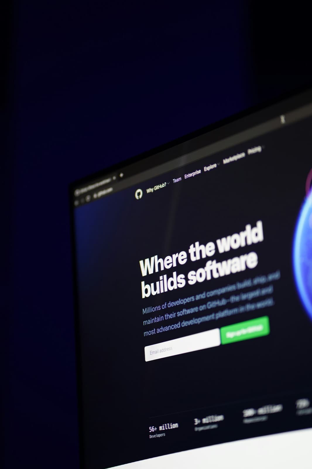 Close-up of a GitHub landing page on a monitor